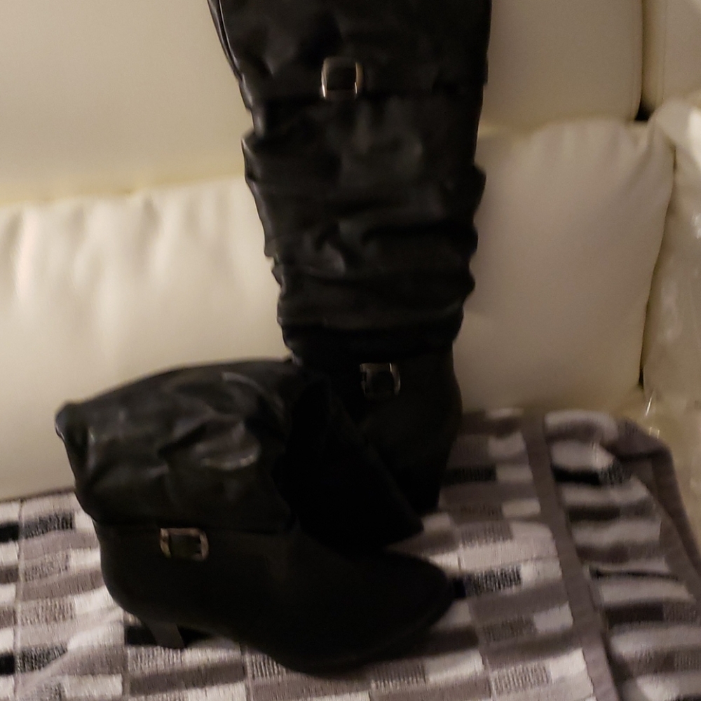 Never worn black heeled boots with buckles